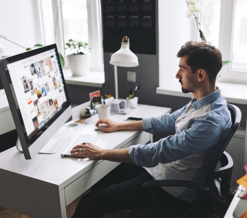 Designer or marketer working on a campaign, website development, creative workspace.